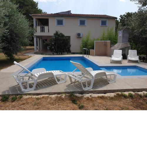Apartment in holiday home with pool