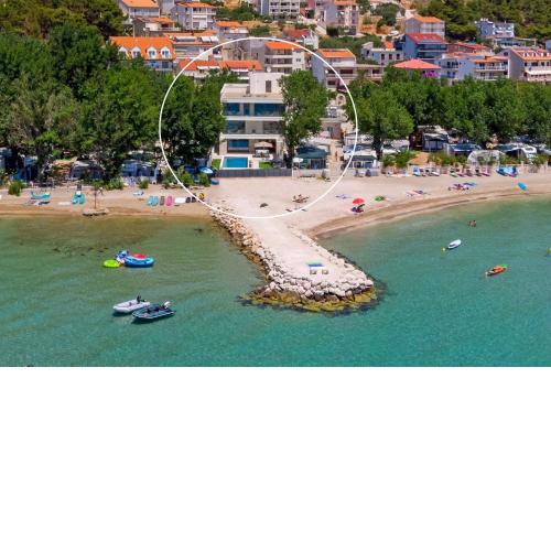 Beachfront Villa Erce with private 40sqm heated pool, a Gym, 7 en-suite bedrooms, a rooftop terrace, 2 living areas