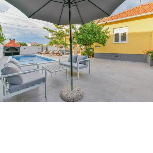 Holiday homEna with a heated pool