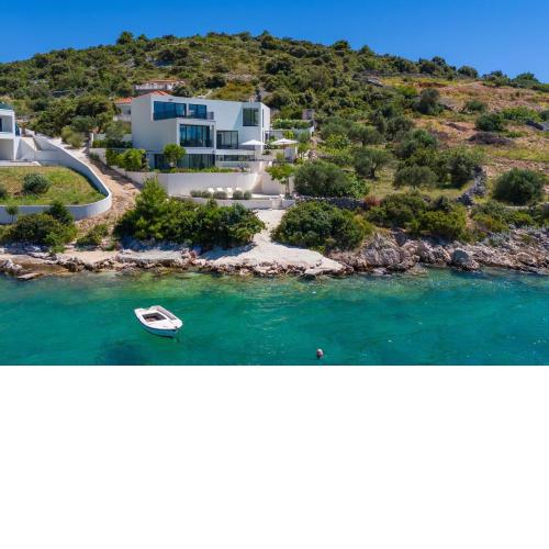 Luxury Seafront Villa Roots with private, heated pool, 5 en-suite bedrooms, enchanting sea views