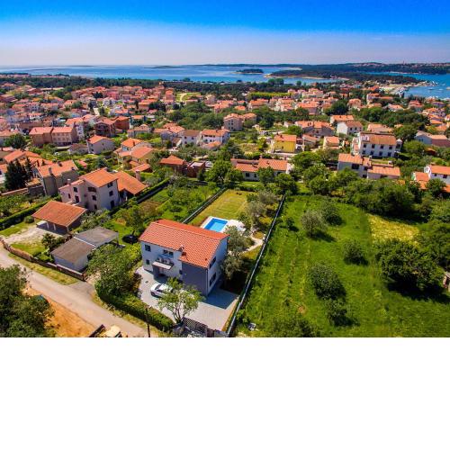 Luxury villa Medulin with pool near the beach , sea view, extra pool heating available
