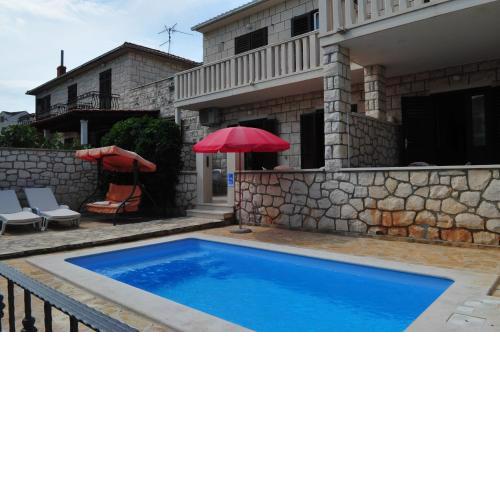 Seaside apartments with a swimming pool Supetar, Brac - 11360