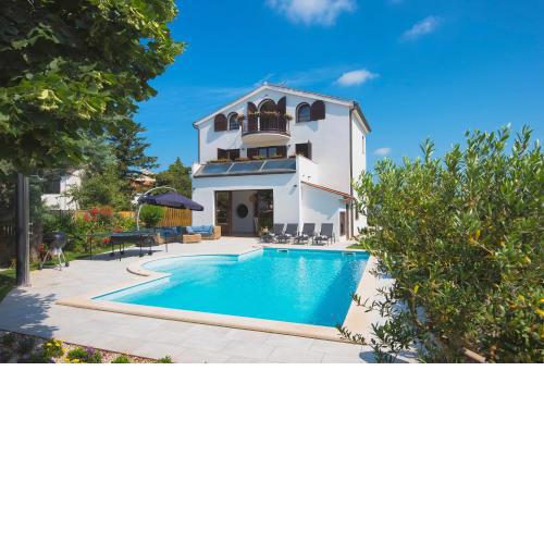 Villa Andrija Family Dream with heated pool at the sea with beautiful garden, outside cinema and kids playground