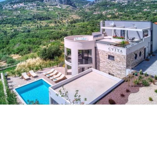 VILLA CVITA is a modern 5-bedroom villa with a Jacuzzi, a Gym and Finnish Sauna, a heated pool, and amazing views