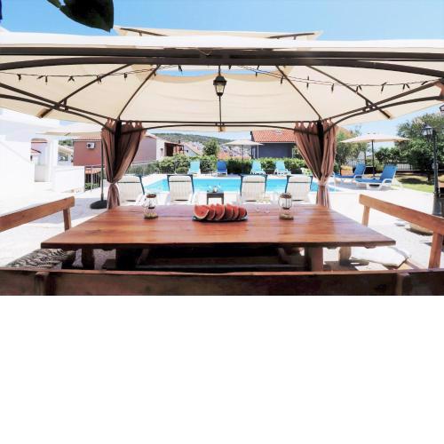 Villa Mendula Trogir - Luxury beachfront villa with large pool area surrounded by organic vegetable garden and olive trees